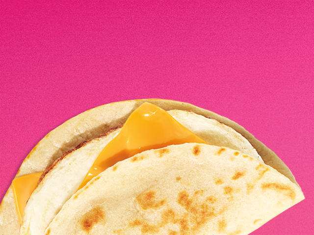 A sausage, egg, and cheese sandwich on an English muffin & A veggie egg white sandwich